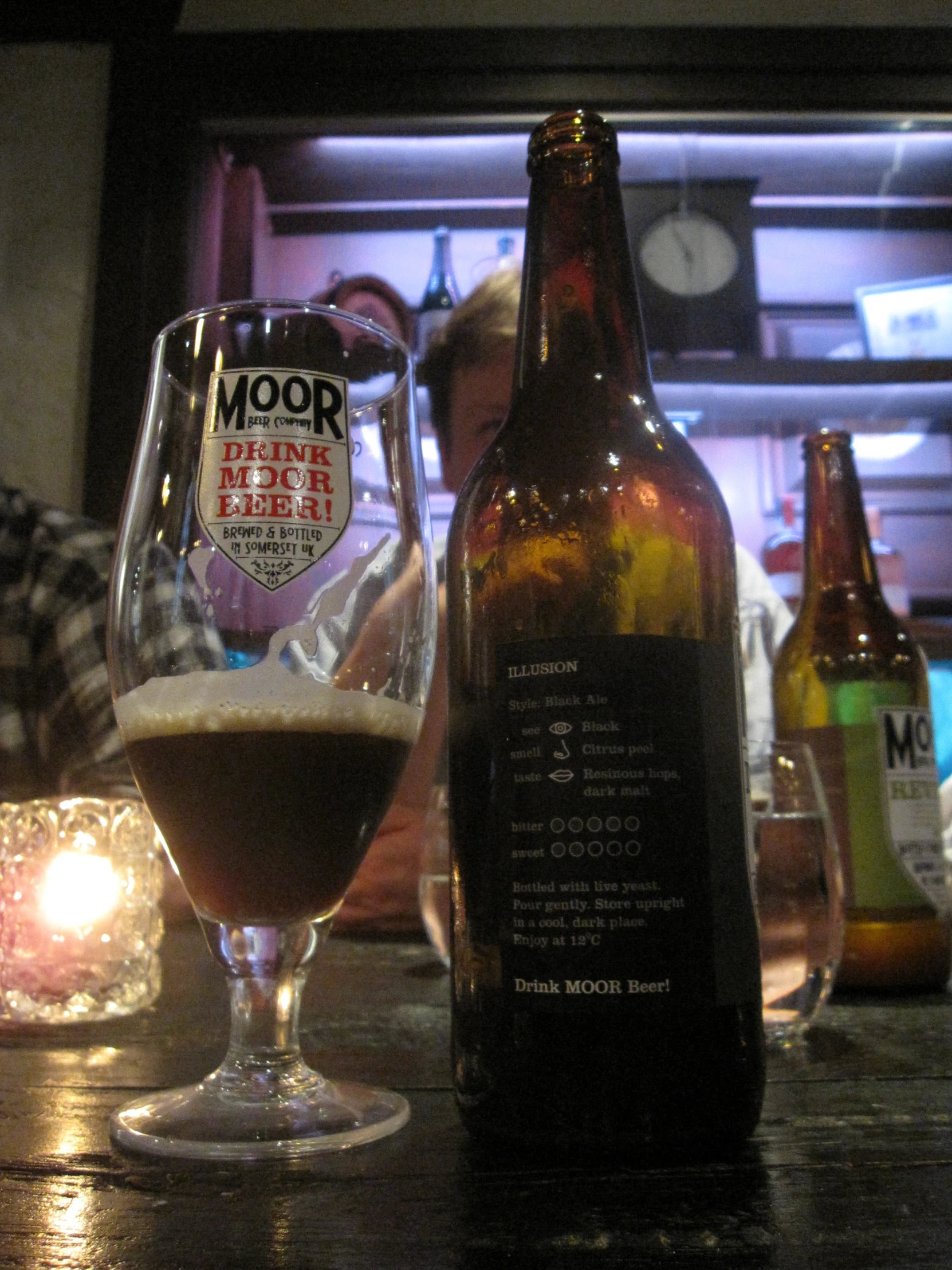 a beer bottle sitting on top of a table