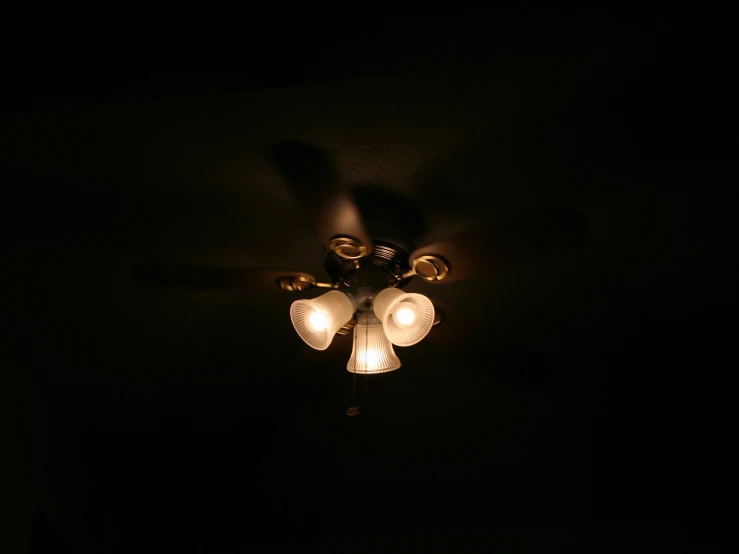 an image of a light fixture in the dark