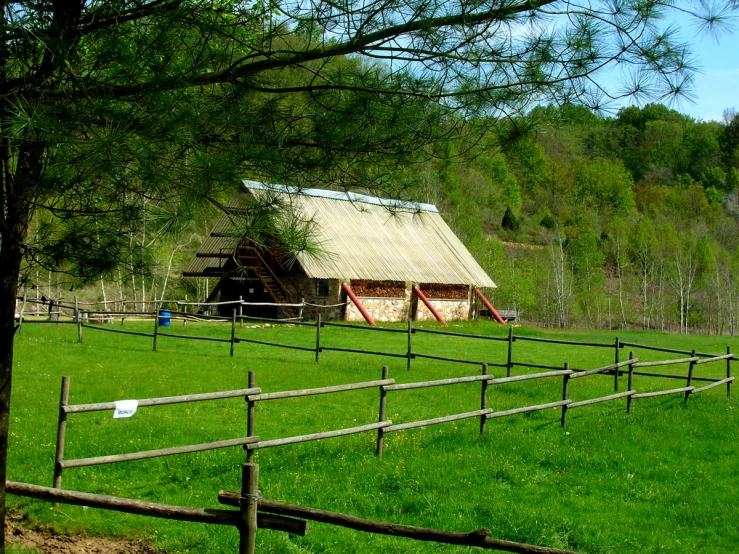 a rural farm is seen from the other side