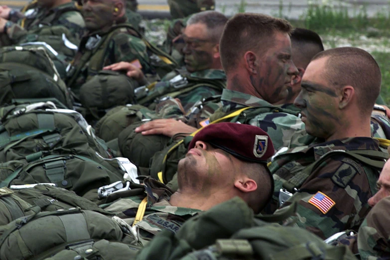 military men all lined up and taking selfies