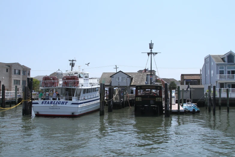 boats are docked on a city waterfront