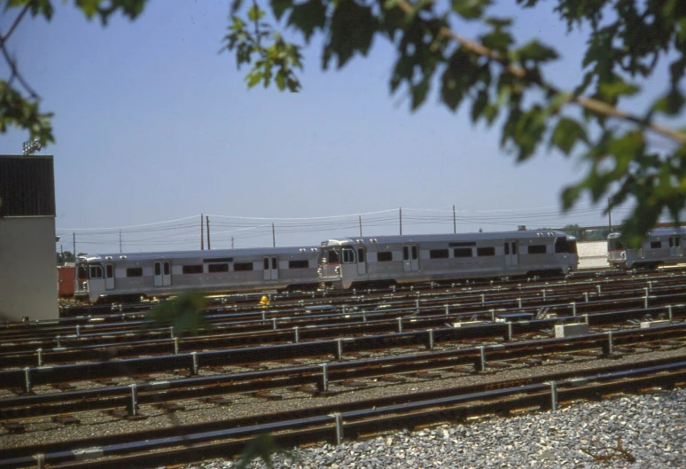 two trains that are next to each other on a rail road track