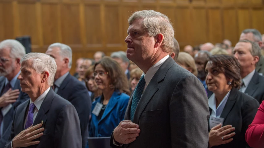 group of men and women in a court