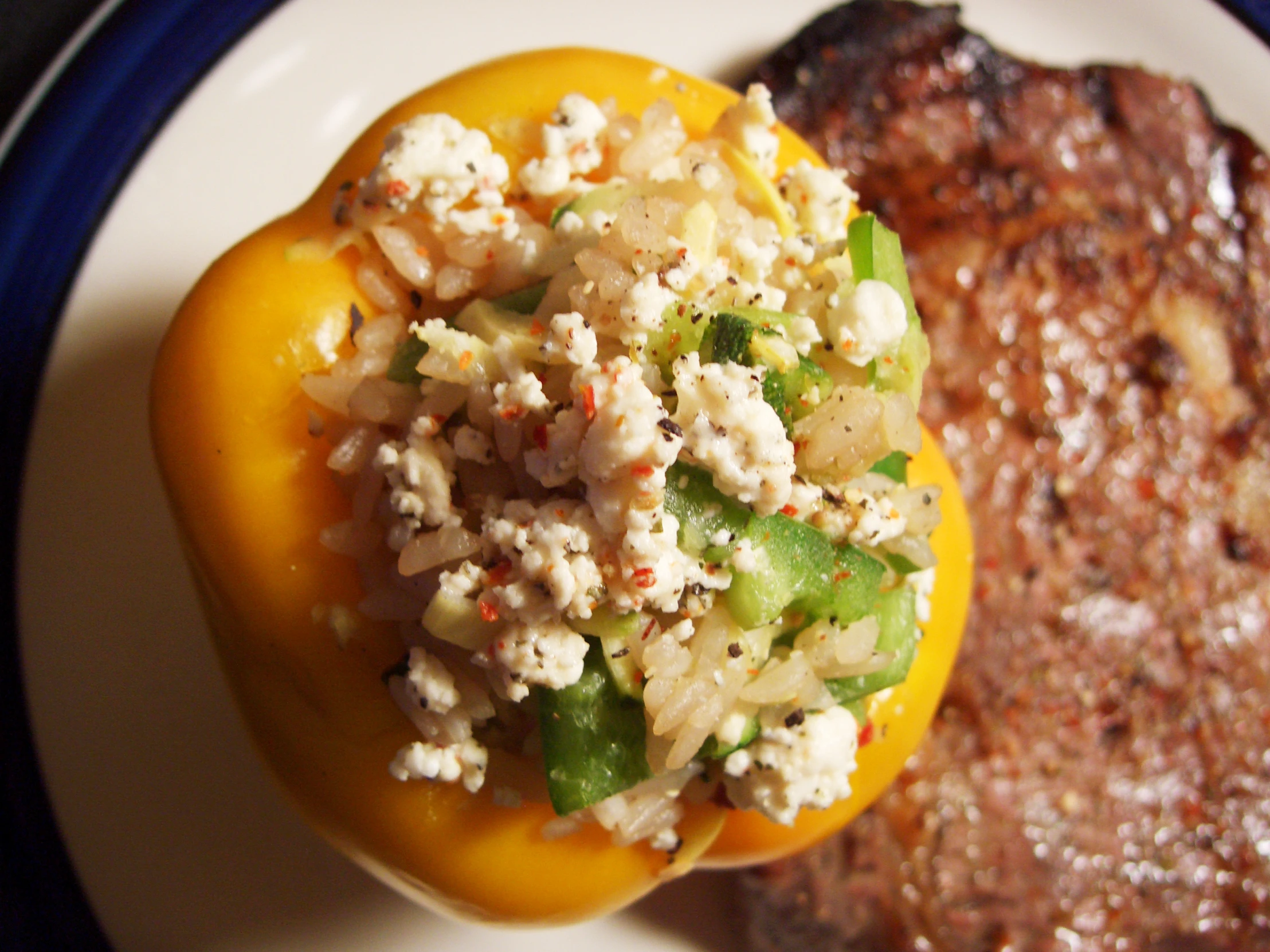 a grilled steak with a fresh salad and a sweet chili