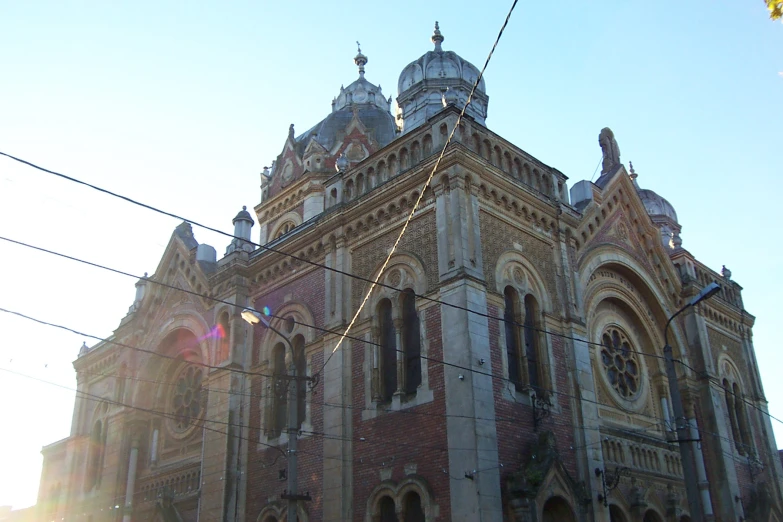 an old, ornate building is shown in the sunlight