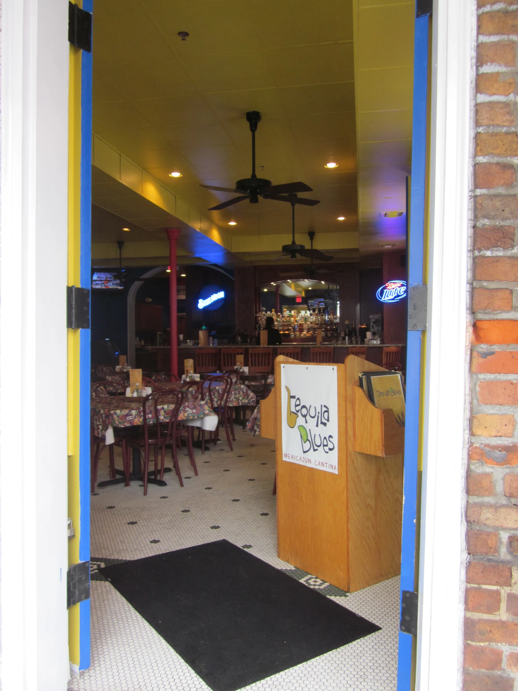 an open doorway leads into a dining area