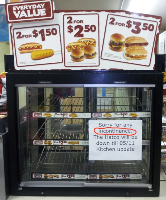 the sign above the display offers different varieties of sandwiches