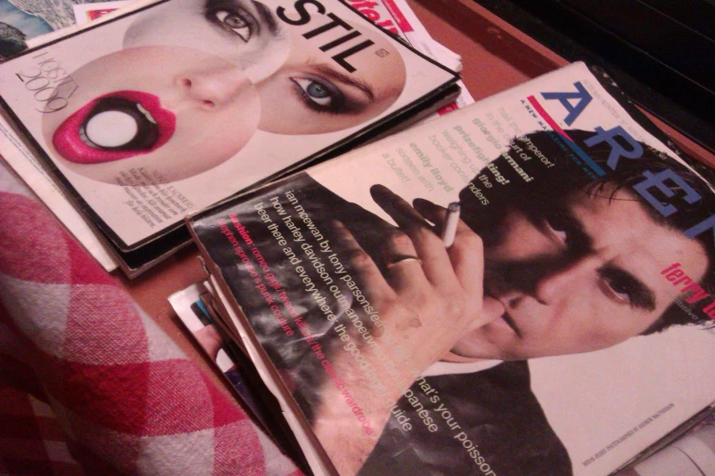 two magazines sit on top of the table