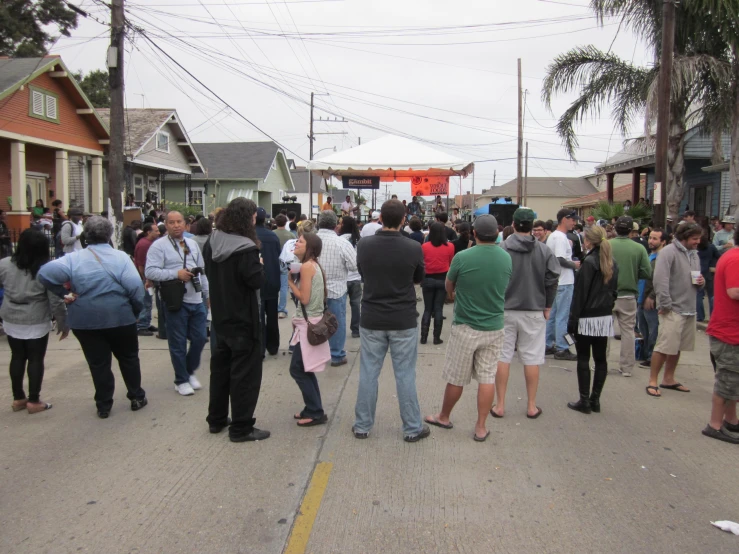 a group of people gather together on a street