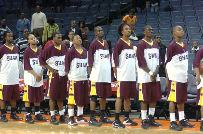 a group of people standing on top of a court