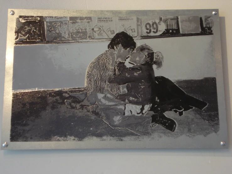 black and white pograph of couple kissing in kitchen