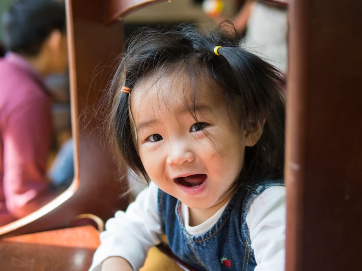 a small child that is sitting on the ground