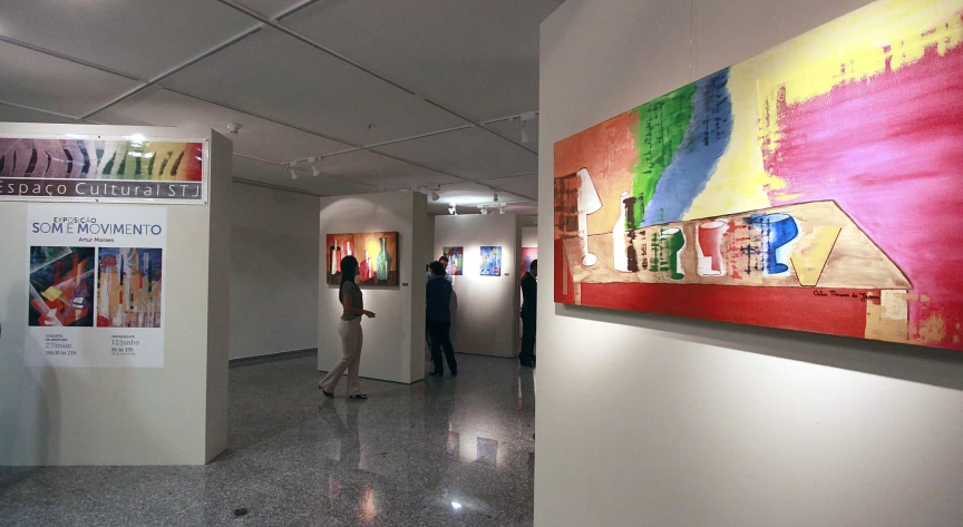 art gallery with large paintings on display in open space