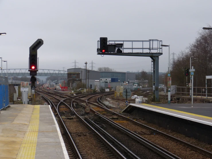 an overpass over a rail road track in the middle of nowhere