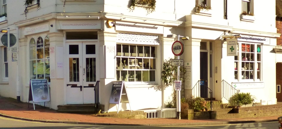 a building on the side of the street has several windows