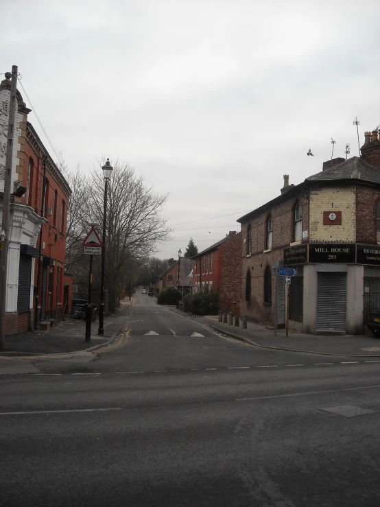 street corner in front of houses on cloudy day