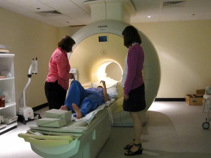 two women in a medical emergency room looking at a woman