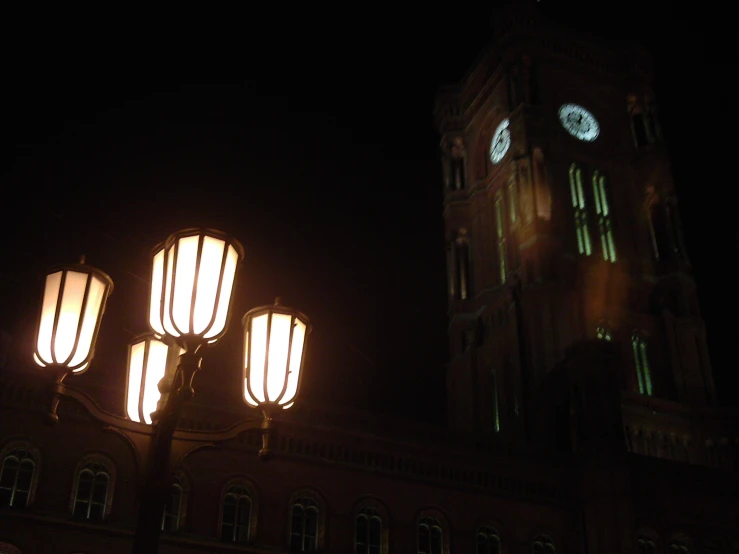a clock tower lit up at night time