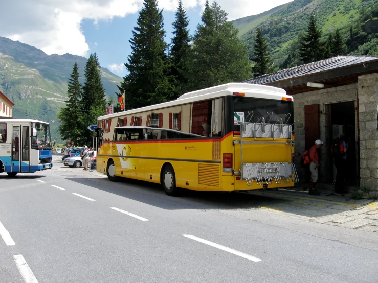 the bus is parked at the bus station