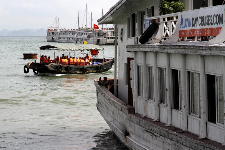 several boats in the water near a building