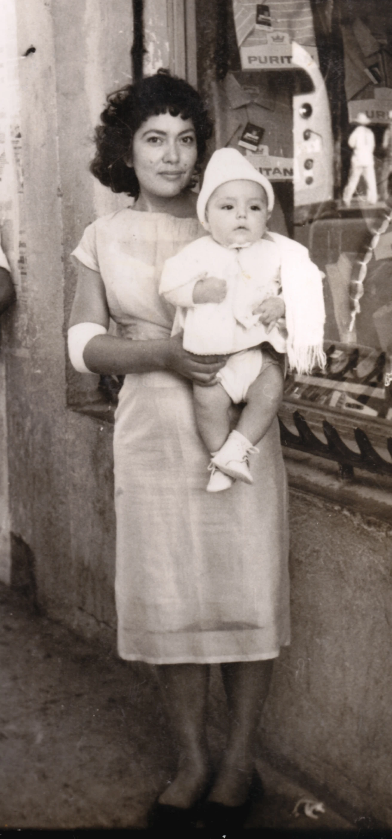 this is an old po of a lady holding her child