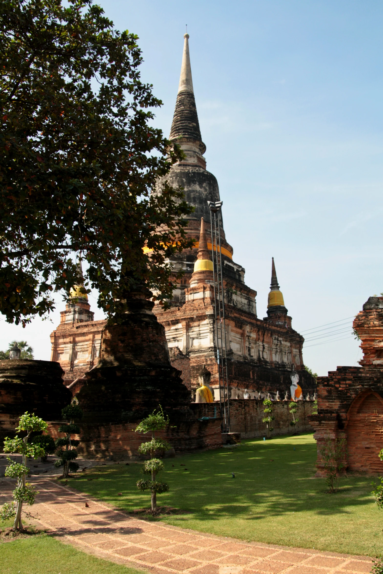 an ornate building with two spires and brick blocks