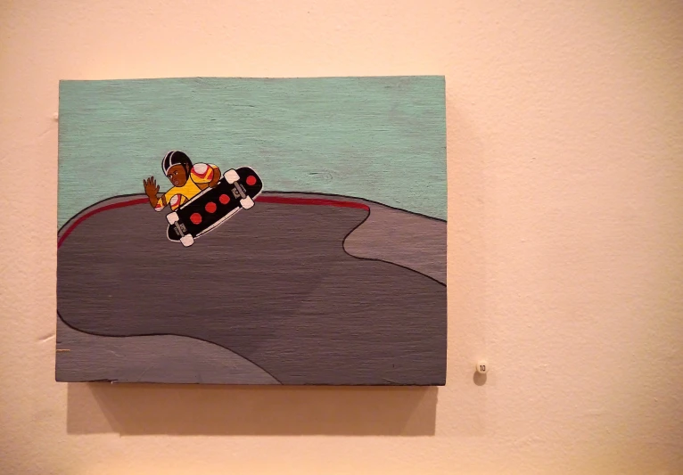 a painting is hanging on the wall, it depicts a person driving a car