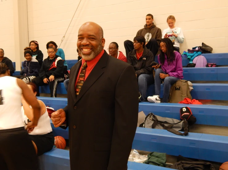 a man standing next to a child in a sports stadium