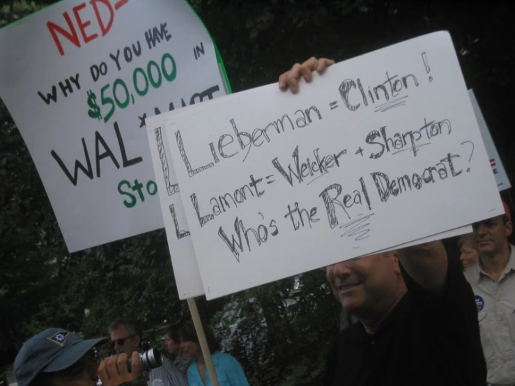 people standing outside, holding up placares that say labor = weimar = republican + equal = state = do you vote?