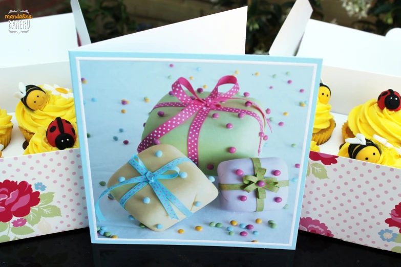 greeting card with yellow cupcakes and decorated decorations