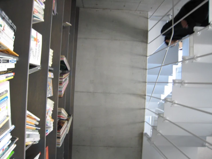 the interior of a building with white bookshelves