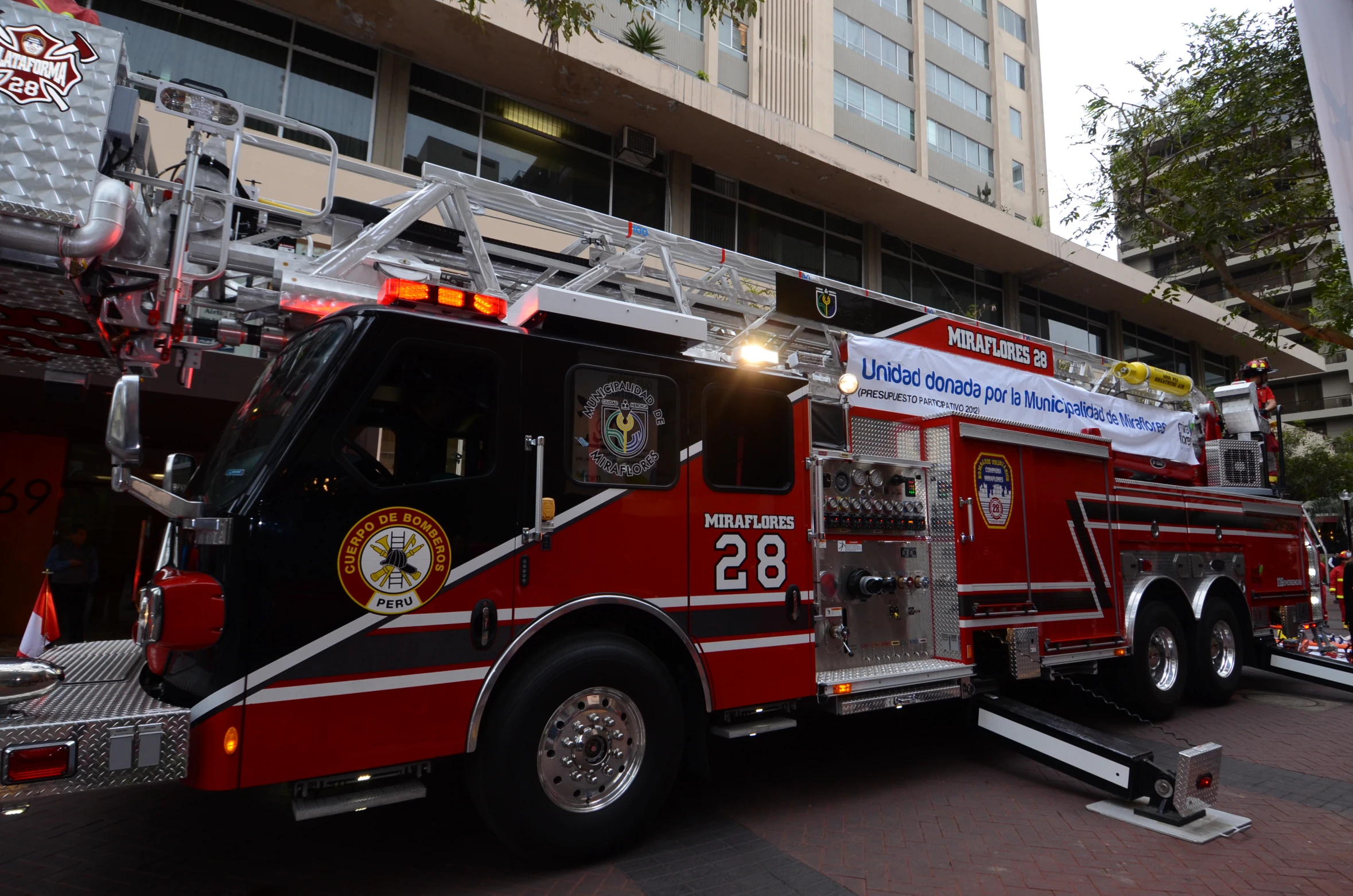 a red fire truck with the number twenty on it