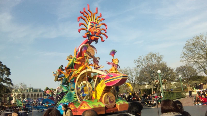 a float being paraded in a parade during the day