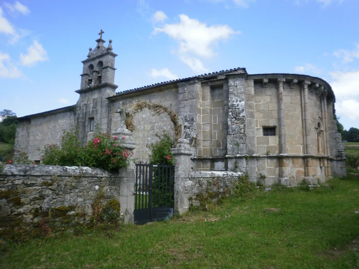 the large old stone building is by the church