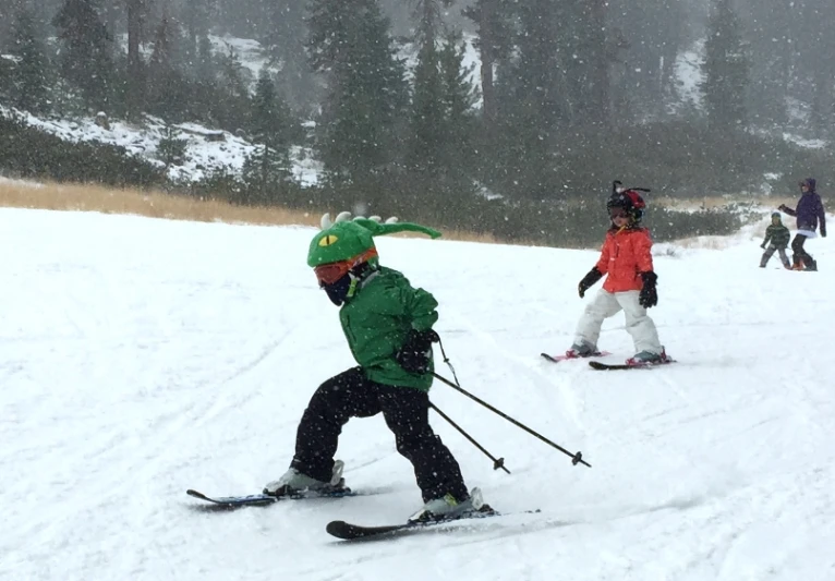 some s going down a hill on their skis