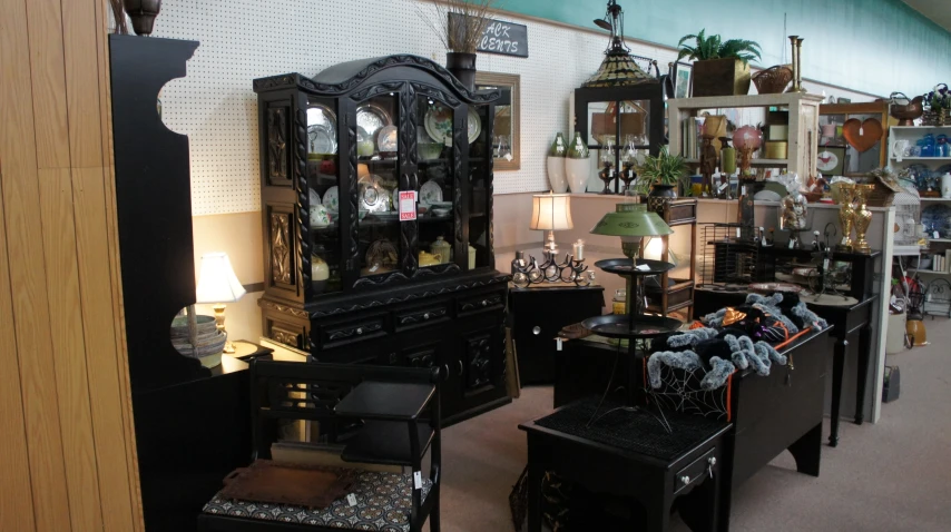 a very ornate display of antique furniture in the store