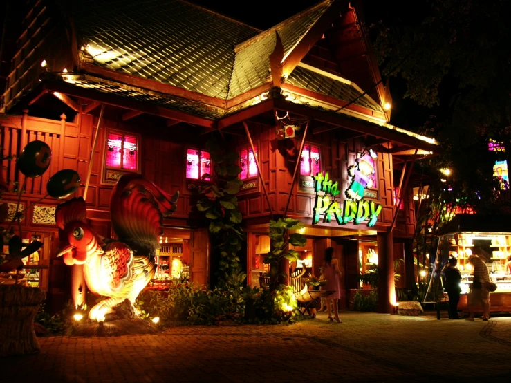 an outside nighttime scene of a restaurant in town