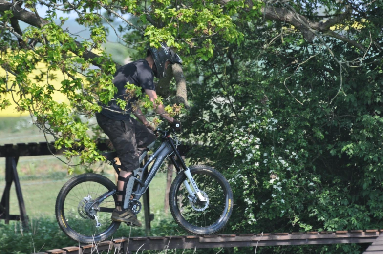 a man riding on the back of a dirt bike