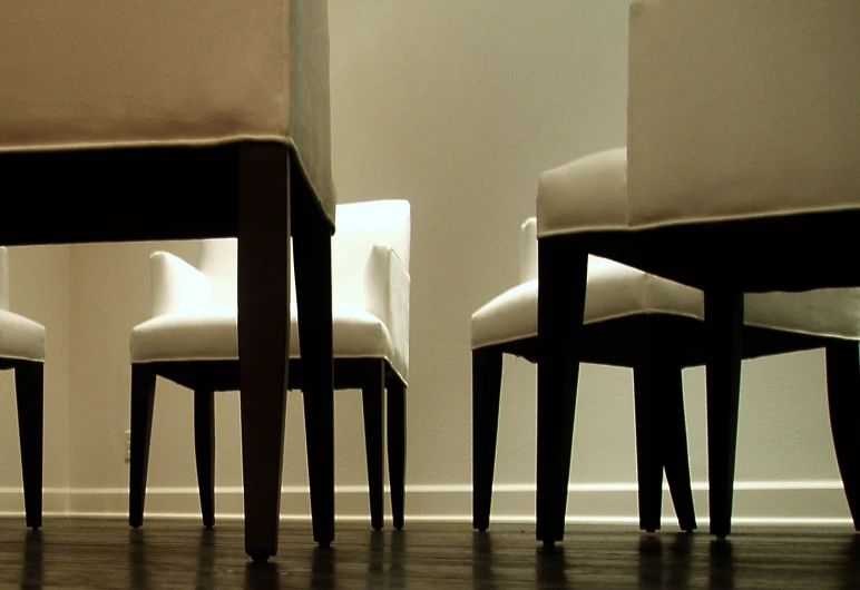 white chairs and a table in a room