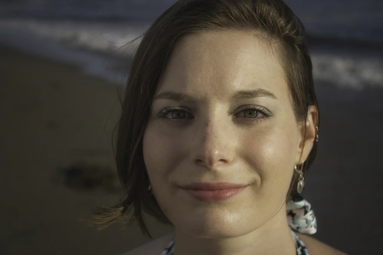 a smiling woman with a flower necklace on her neck