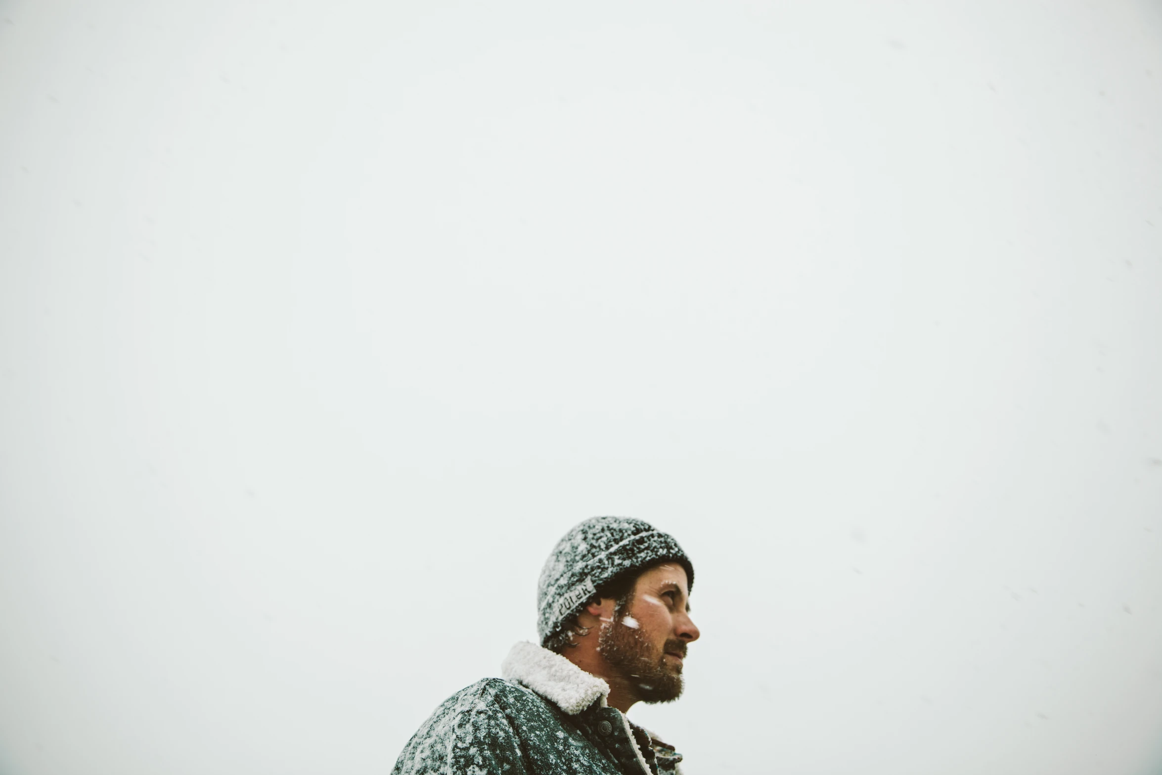 a man that is standing in the snow