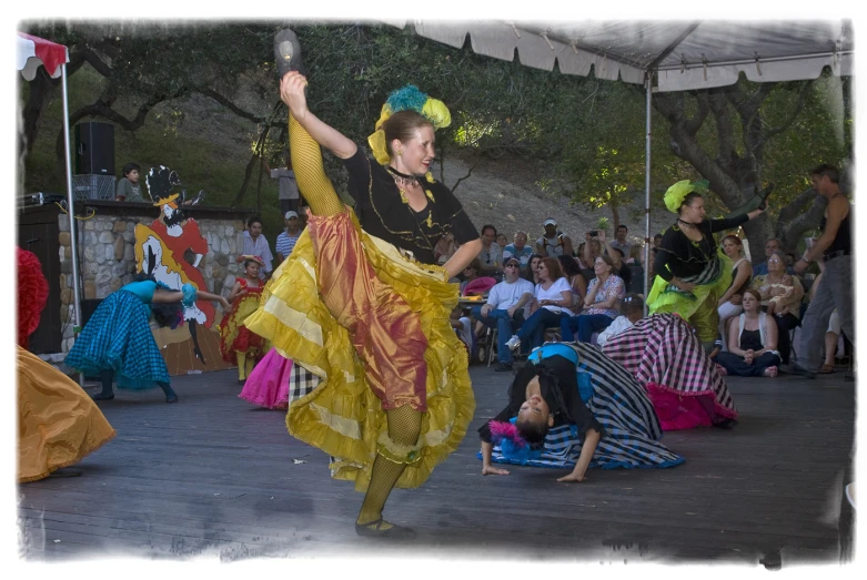 a woman wearing an elaborate dress while dancing