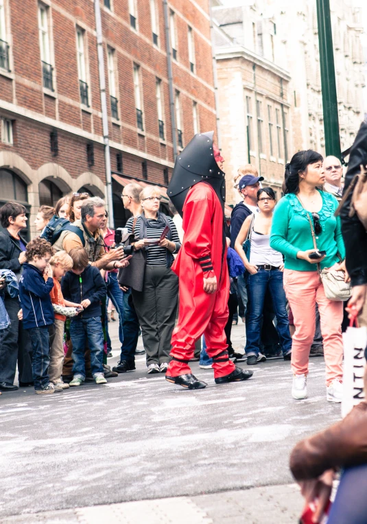 a large group of people standing in the street