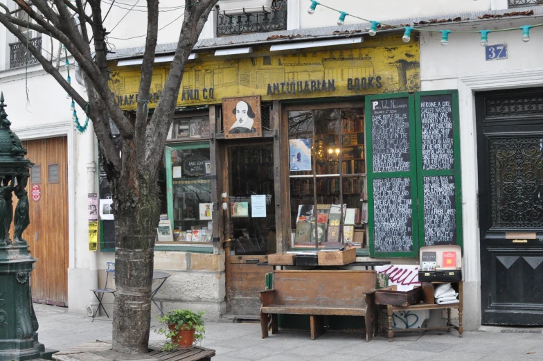 an old looking furniture shop on a city sidewalk