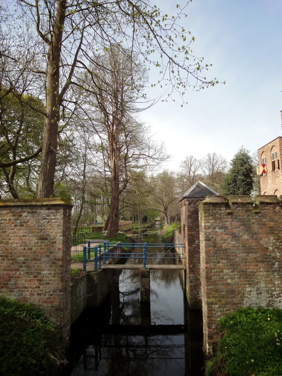 a small bridge in the middle of a canal