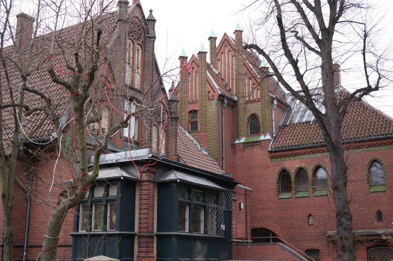 an ornate building with a clock tower and green door