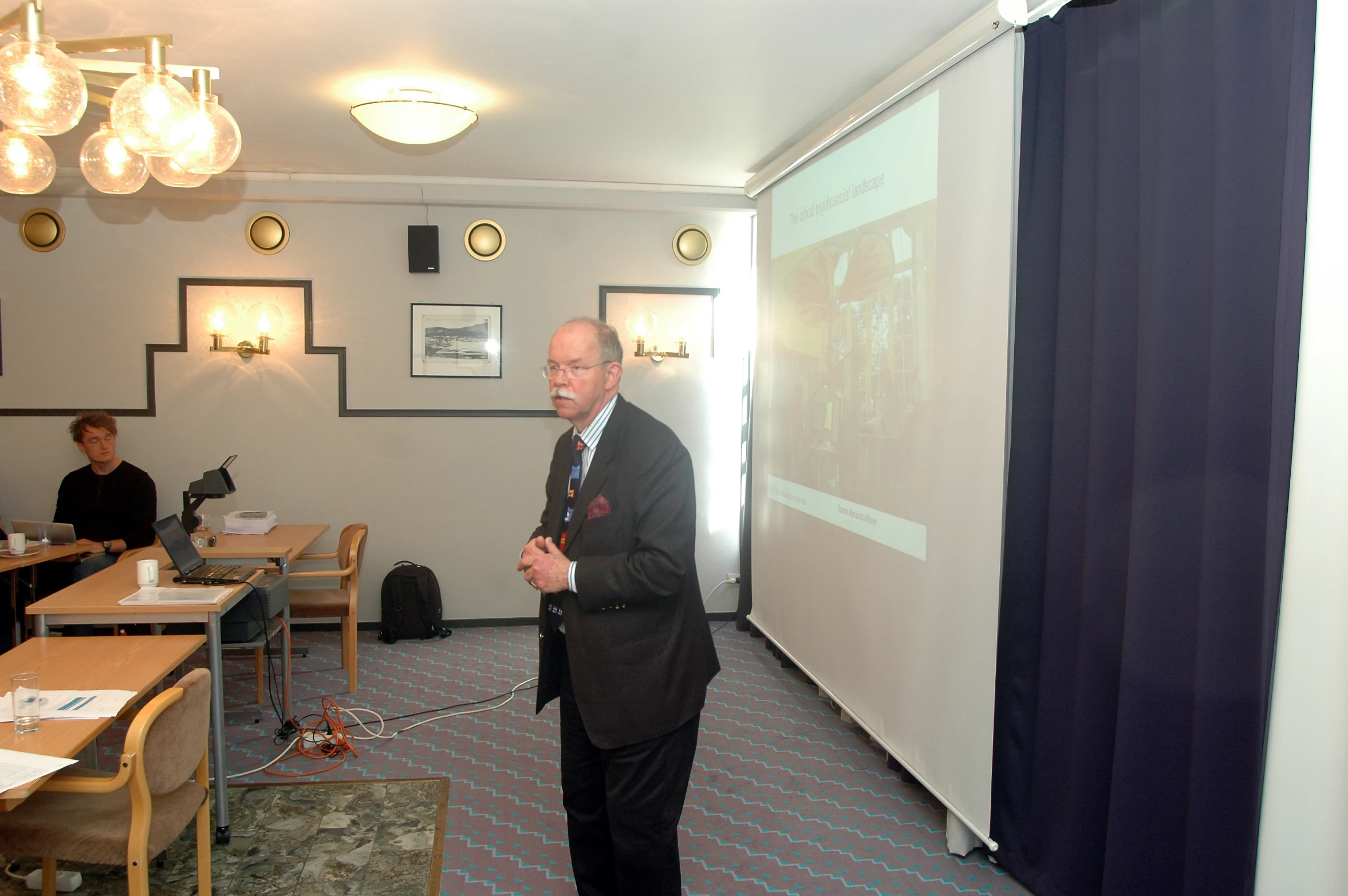 a man giving a presentation to a class