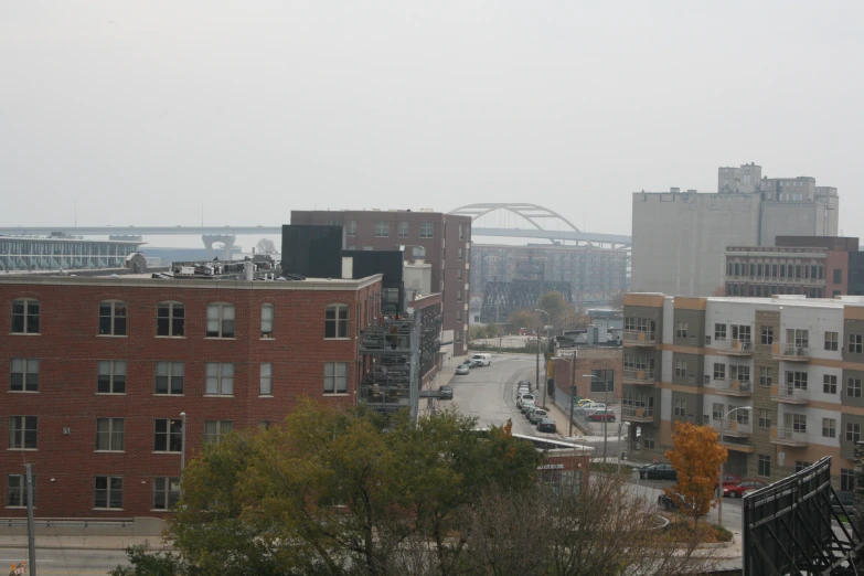 a street next to buildings and cars on a road