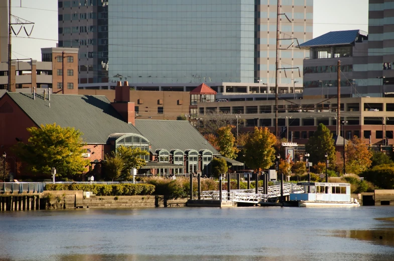 two boats on the water in front of some buildings