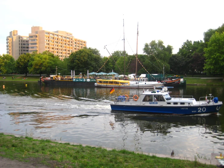 a group of boats floating on top of a river